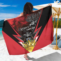 Red and black sarong coat with Antigua and Barbuda crest and deer emblem