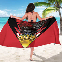 Red and black sarong coat, back view, Antigua and Barbuda crest with deer emblem