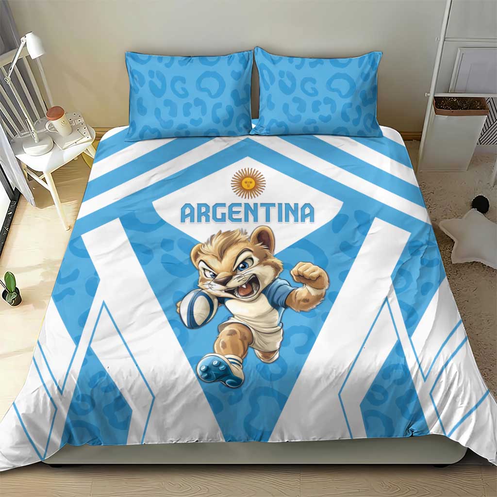 Blue and white Argentina bedding set on bed, leopard mascot center with geometric stripe accents.