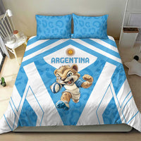Blue and white Argentina bedding set on bed, leopard mascot center with geometric stripe accents.