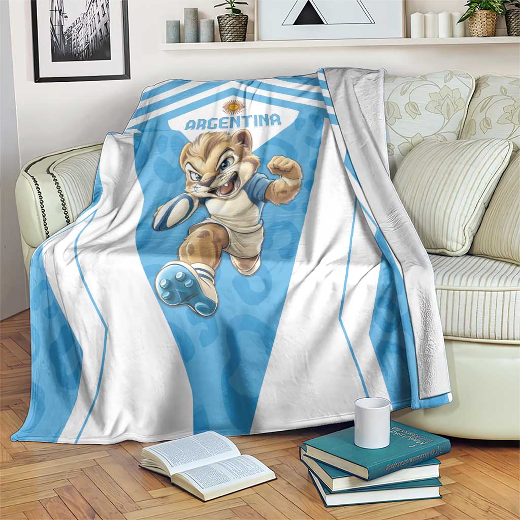 Argentina sports blanket on couch, blue stripes with mascot graphic and emblem