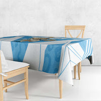 Blue and white geometric rugby tablecloth draped on rectangular dining table