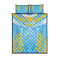 Blue quilt bed set with yellow lightning pattern, crest, and two matching pillows