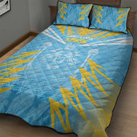 Blue quilt bed set with white and yellow cricket graphic and two square pillows