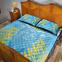 Blue quilt bed set with yellow cricket rays design and two dark-trim pillow shams
