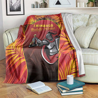 Red cricket blanket with Knight Riders mascot and tropical leaf border