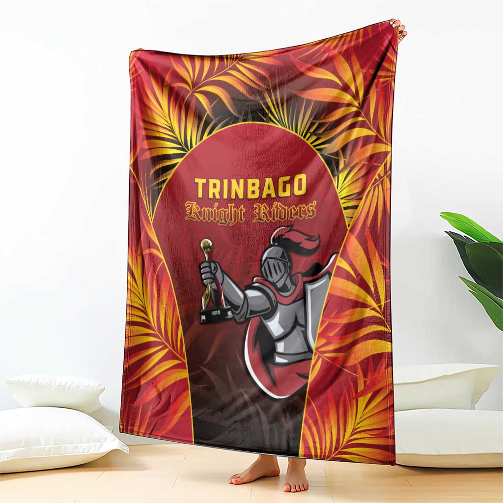 Red cricket blanket draped on floor with large Knight Riders logo
