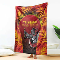 Red cricket blanket draped on floor with large Knight Riders logo