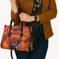 Red tote bag with black straps, metal grommets, and TRINBAGO Knight Riders logo