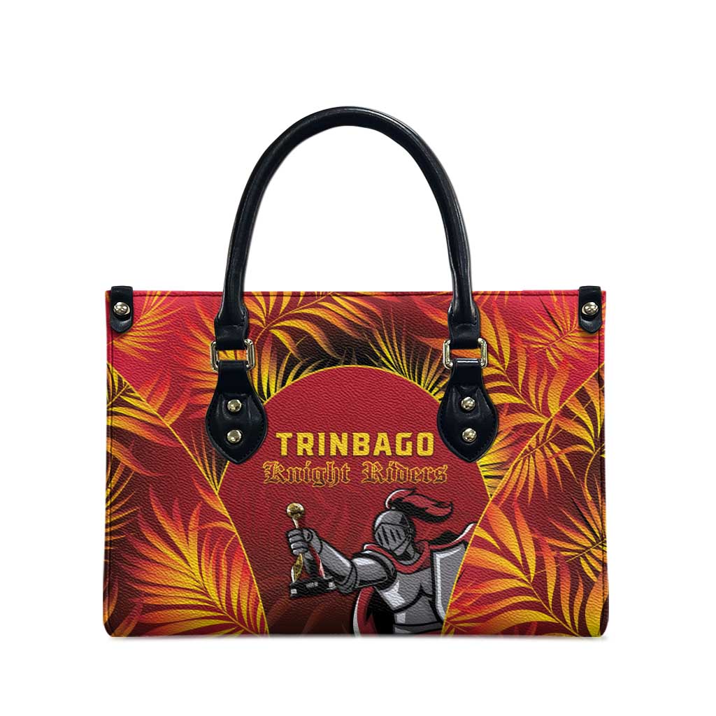 Red tote bag with black top handles and TRINBAGO Knight Riders front graphic