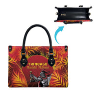 Red tote bag with black handles and TRINBAGO Knight Riders front graphic; blue arrow
