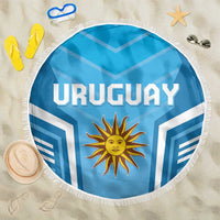 Round blue Uruguay beach blanket with white fringe, sun emblem, 150cm diameter