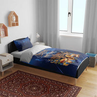 Blue Hanukkah bedding set on bed with menorah and candles graphic and Happy Hanukkah text