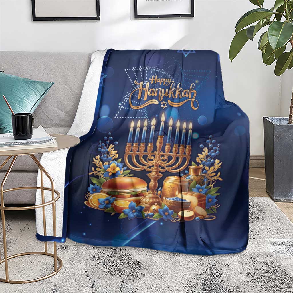 Blue Hanukkah blanket with menorah and 'Happy Hanukkah' graphic, laid on floor rug.