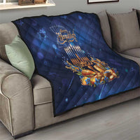 Blue Hanukkah quilt on sofa with menorah candles, golden floral details, and stars