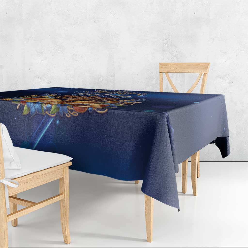 Blue Hanukkah tablecloth with menorah motif and draped corner on dining table
