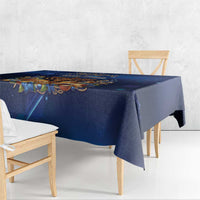 Blue Hanukkah tablecloth with menorah motif and draped corner on dining table