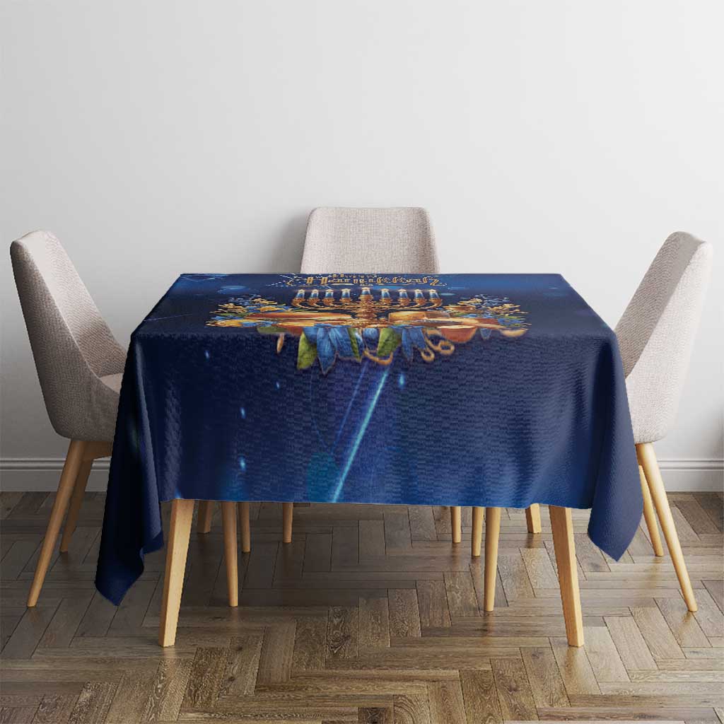 Blue Hanukkah tablecloth on dining table featuring menorah and gold accent details