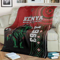 Kenya Jamhuri Day blanket on couch, red and dark with green lion and Kenya print