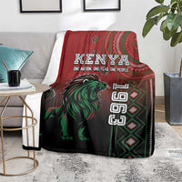 Kenya Jamhuri Day blanket on gray seat, red and dark with green lion motif