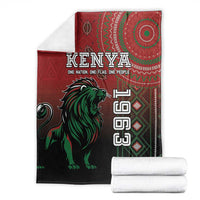 Kenya Jamhuri Day blanket folded, red and dark with green lion and Kenya lettering