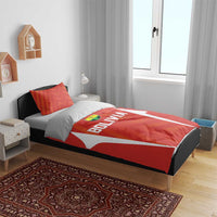 Red Bolivia bedding set with 'BOLIVIA' duvet design and two orange-pattern pillows