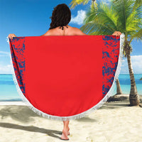 Red round England beach blanket shown from the back, with blue side splashes and white fringe.