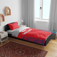 Red England bedding set on bed with duvet and pillowcases, lion crest and ENG print