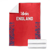 Red England cricket blanket flat with Three Lions logo and blue patterned corners