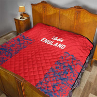 Red quilted bed throw with England lion crest, “ENGLAND” text, and blue splatter section.