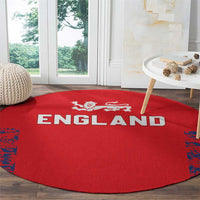 Red round England cricket carpet with white “ENGLAND” text and blue splatter border