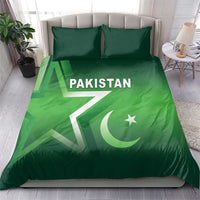 Green Pakistan duvet cover and pillow set on bed, Pakistan text with crescent and star