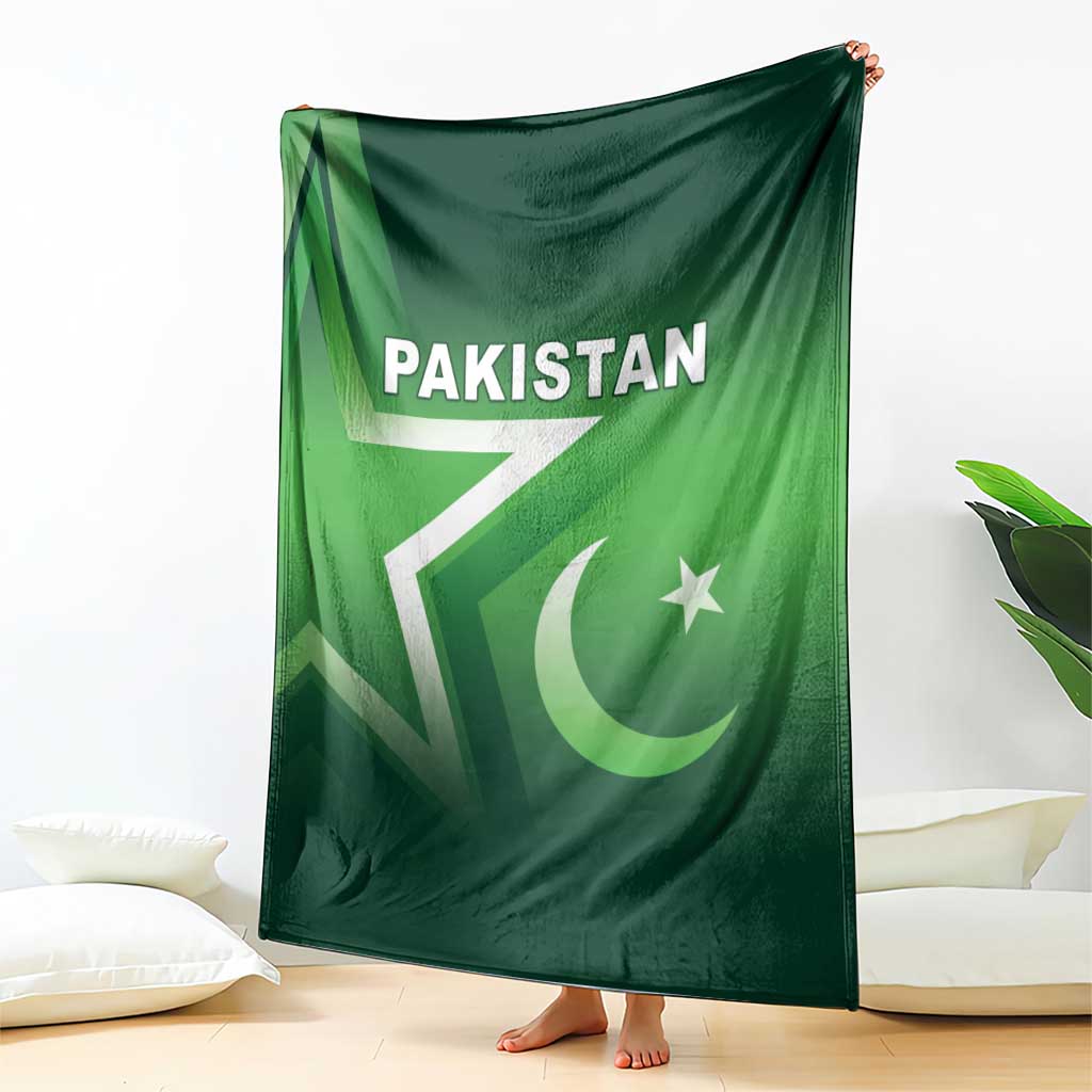 Green Pakistan cricket blanket draped with Pakistan text, white lightning bolt, crescent star