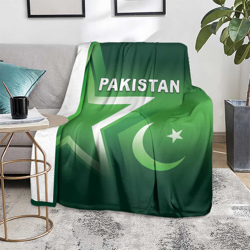 Green Pakistan cricket blanket on a living room chair with Pakistan text and crescent star