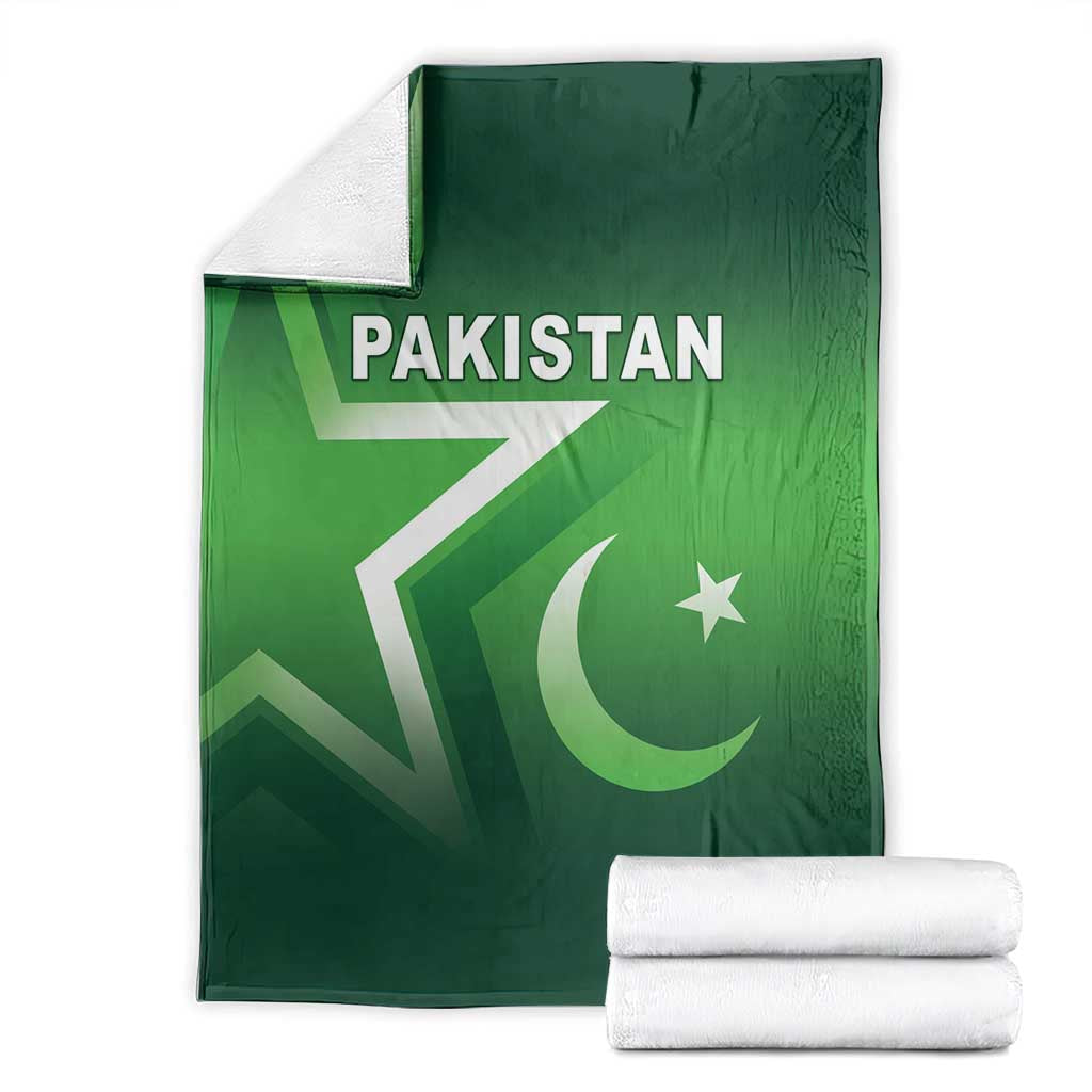 Green Pakistan cricket blanket shown flat with Pakistan text, crescent and star; with rolled towels