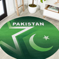 Green round Pakistan rug with 'PAKISTAN' text, star and crescent design