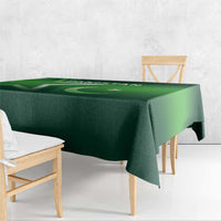 Green Pakistan-themed tablecloth, close view with printed flag motifs on tabletop.