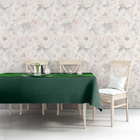 Green Pakistan-themed tablecloth with flag symbols, draped across a dining table.