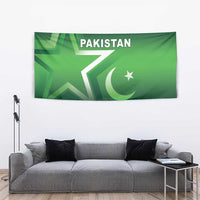Green Pakistan tapestry with star and crescent symbols and 'PAKISTAN' text