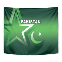 Close-up green Pakistan tapestry with star, crescent, and 'PAKISTAN' text