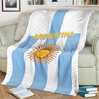 Argentina football blanket on armchair with sun emblem, blue stripe pattern on white