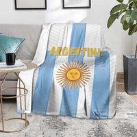 Argentina football blanket laid on rug with bold Argentina text and sun emblem