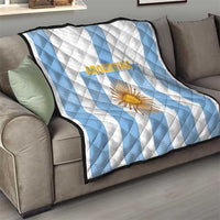 White and light-blue striped quilt with centered sun crest and Argentina text.
