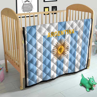 Kids quilt blanket in white and light-blue stripes with centered Argentina sun crest.