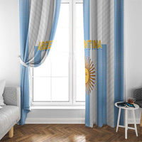 Argentina window curtain panels framing a white window, blue stripes with gold sun emblem.