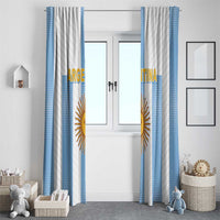 Set of Argentina window curtains with blue side panels and gold sun emblem, hanging on both sides.