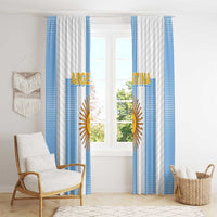 Argentina-themed window curtains with blue stripes and centered gold sun emblem, evenly draped.