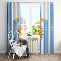 Argentina window curtains on a rod with blue-and-white vertical stripes and gold sun emblem.