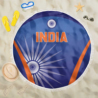 Round blue beach blanket with INDIA text, orange accents, and white fringe border