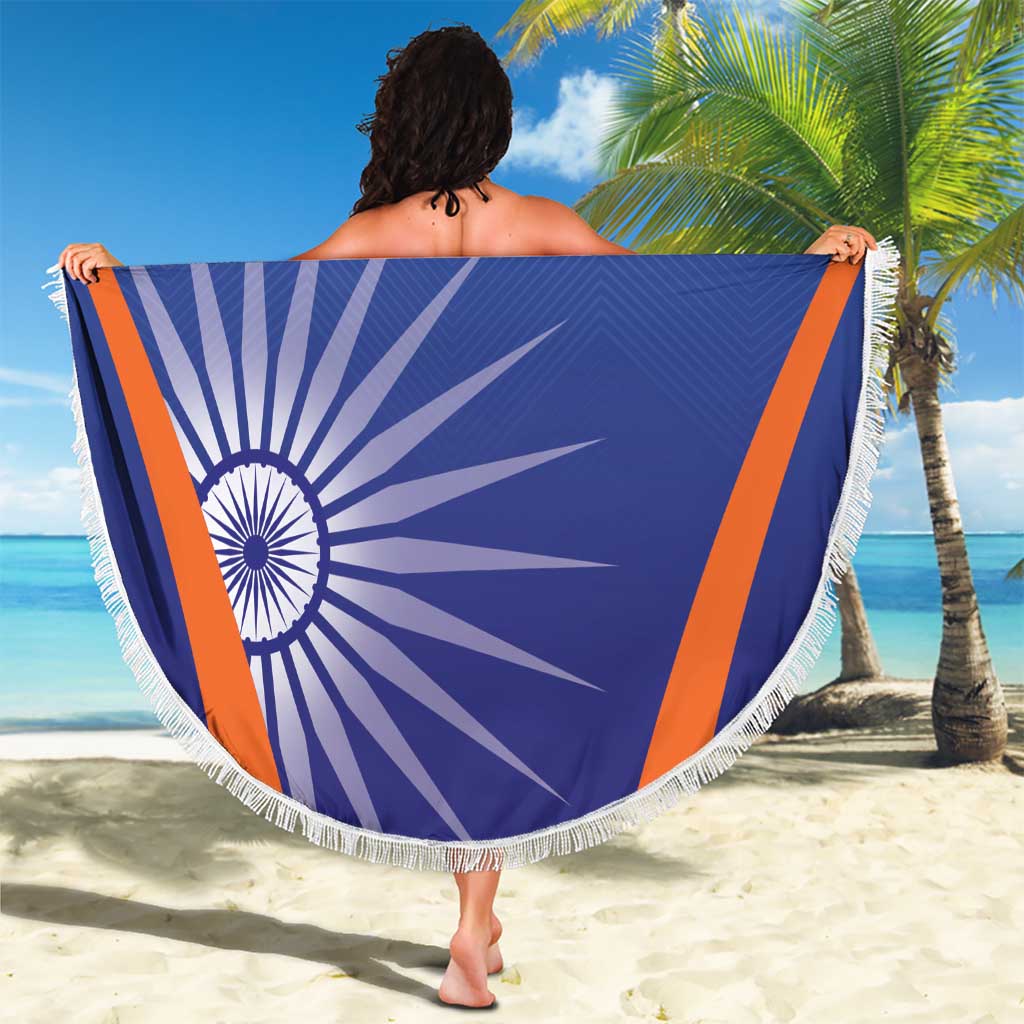 Round blue beach blanket with India emblem, orange stripes, and white fringe edge
